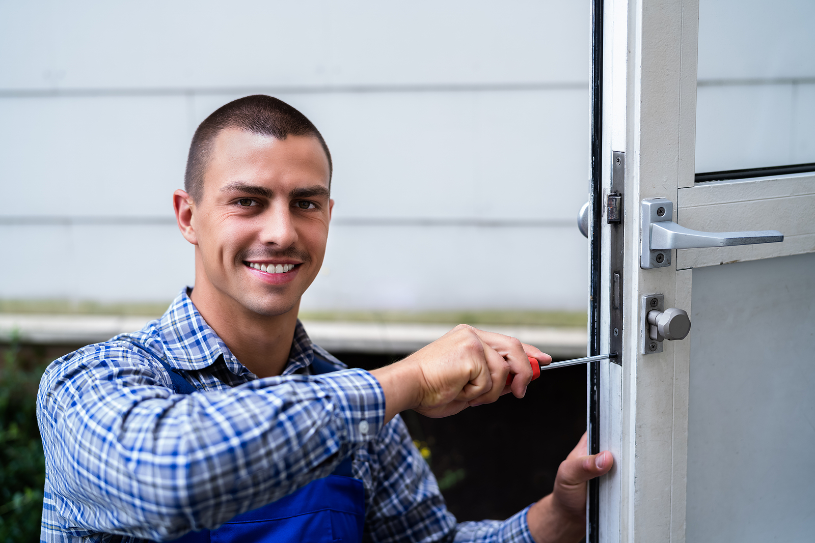 Commercial locksmith technician at work